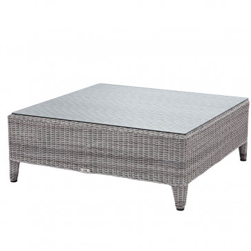 Oceane garden corner coffee table with tempered glass top French grey rattan pictured at an angle on a white background