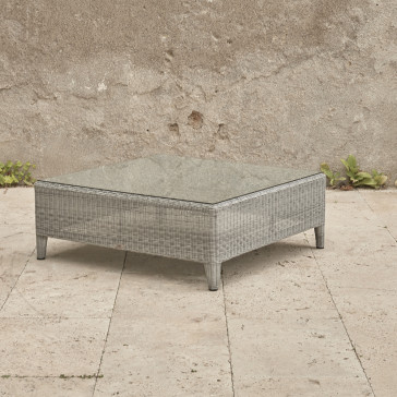 Oceane garden coffee table with tempered glass top French grey rattan pictured on Southern French terrace.