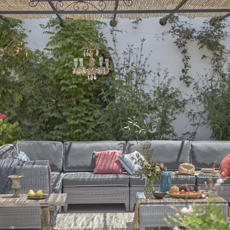 L- shaped modular garden furniture set in French grey with footstool and corner coffee table in Southern French garden